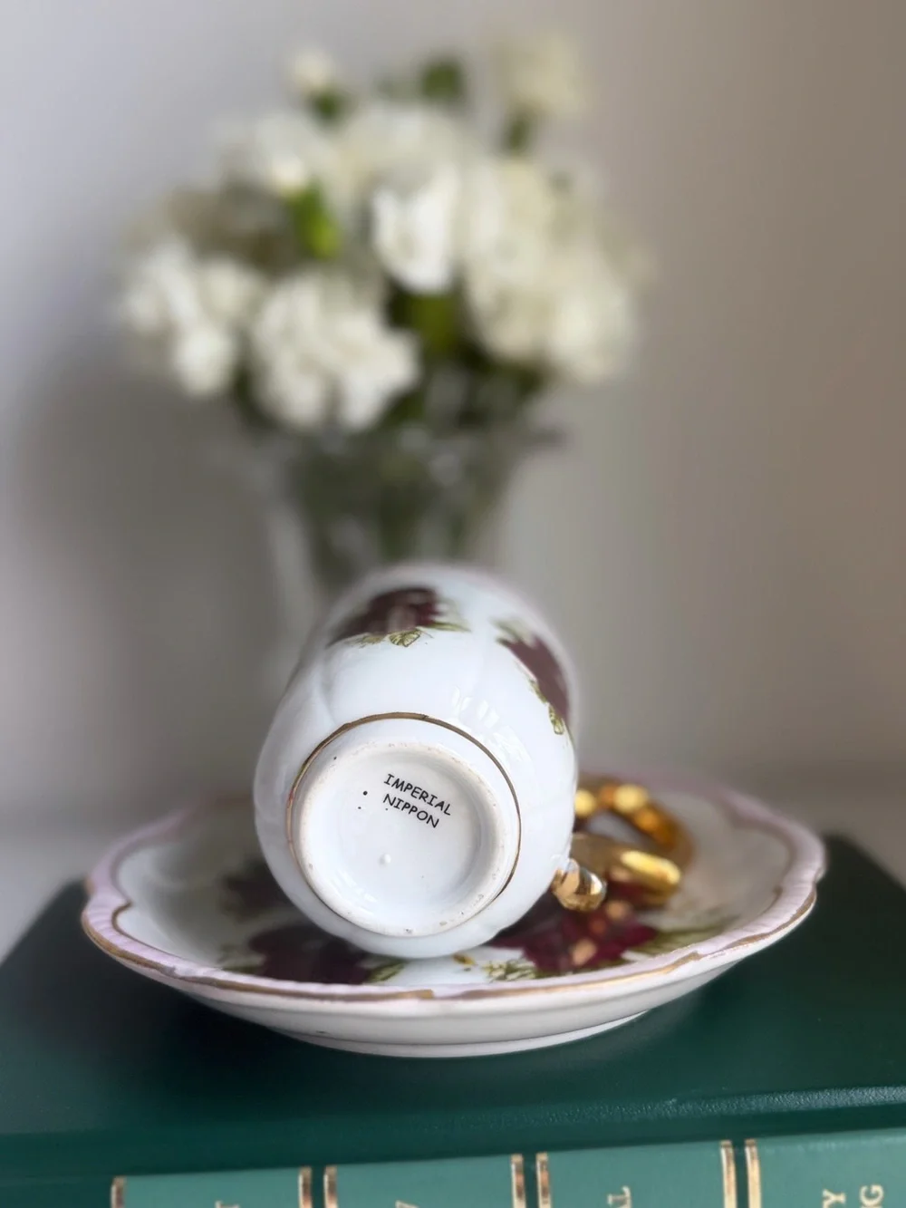Porcelain Tea Cup and Saucer with Burgundy Rose Pattern and Gold Handle